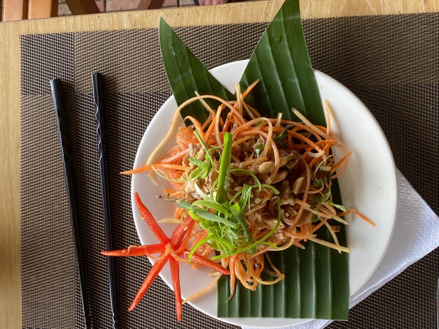 Green papaya salad prepared at Tra Que Garden