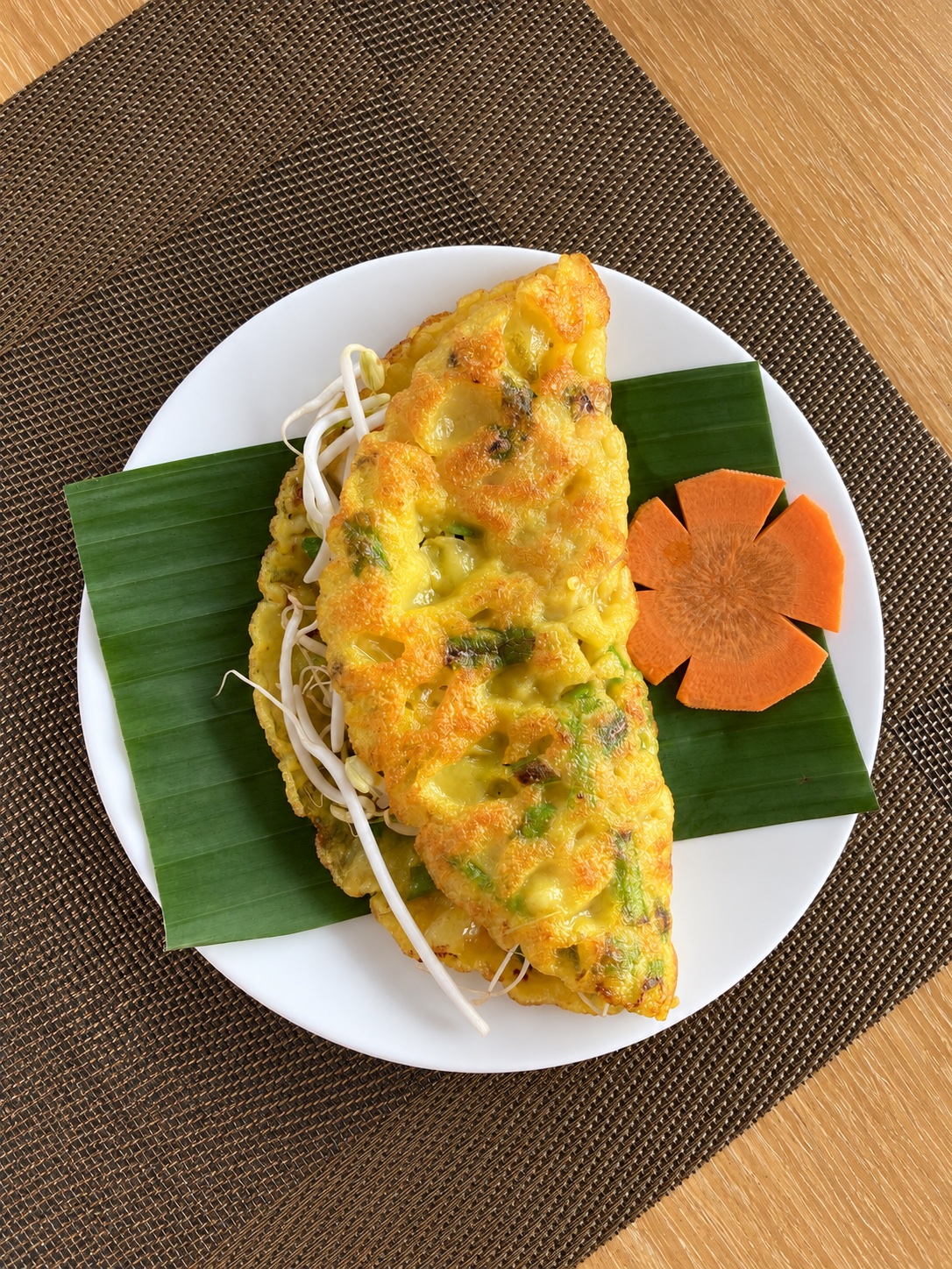 Golden Vietnamese pancake served with herbs at Tra Que Garden